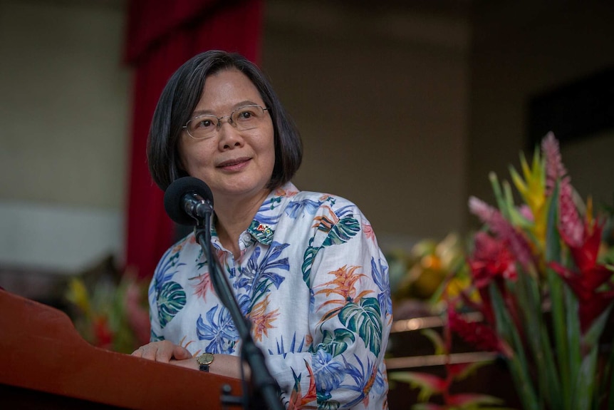 Taiwan President Tsai Ing-wen speaks into a microphone.