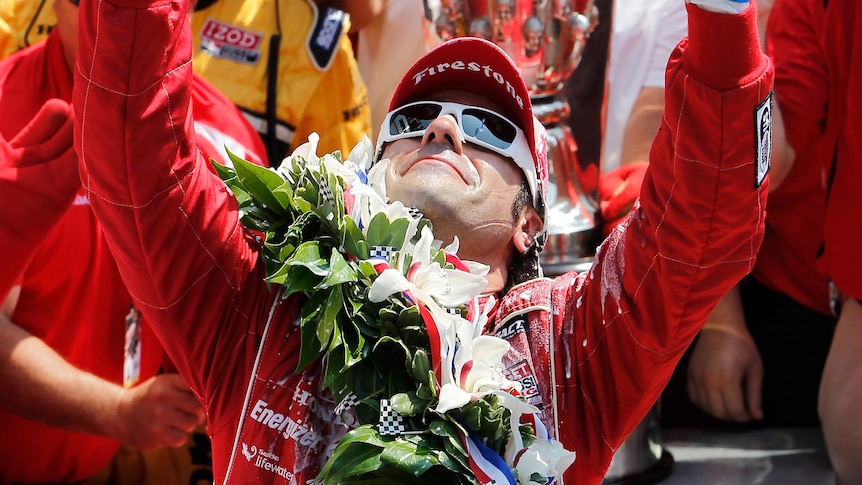 Dario Franchitti points to the heavens after an emotional Indy 500 victory.