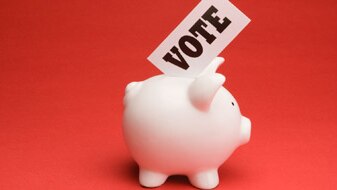 Piggy bank with vote sign (Thinkstock: Comstock)