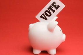 Piggy bank with vote sign (Thinkstock: Comstock)