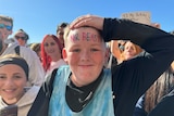 A boy with MrBeast written on his forehead