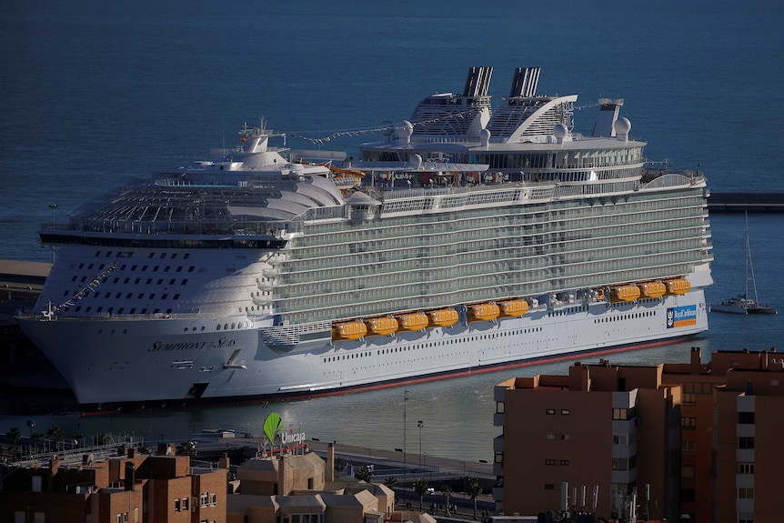 A very, very big cruise ship docked in Spain