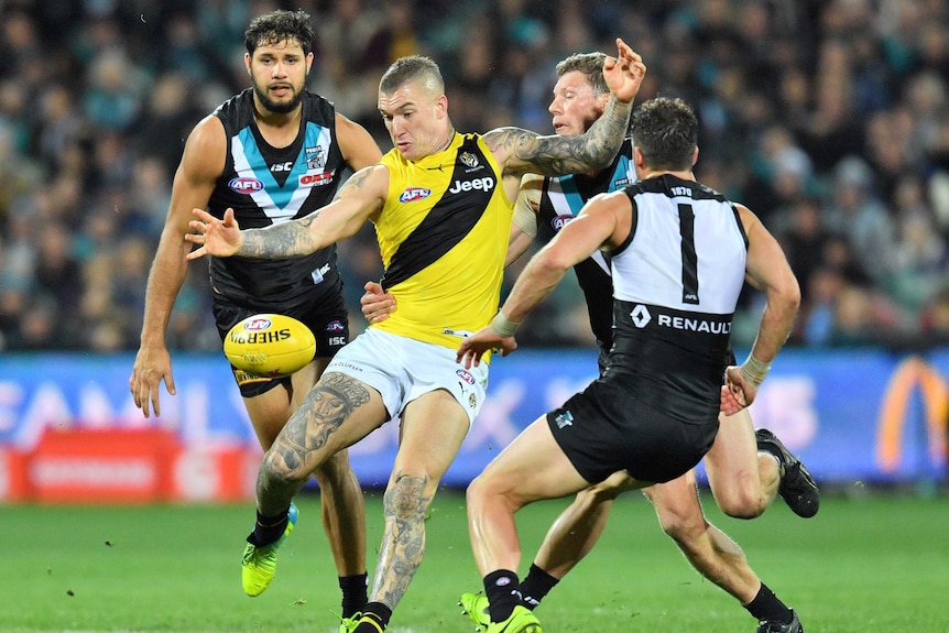 Dustin Martin of the Tigers gets a kick away against Port Adelaide on July 1, 2017.