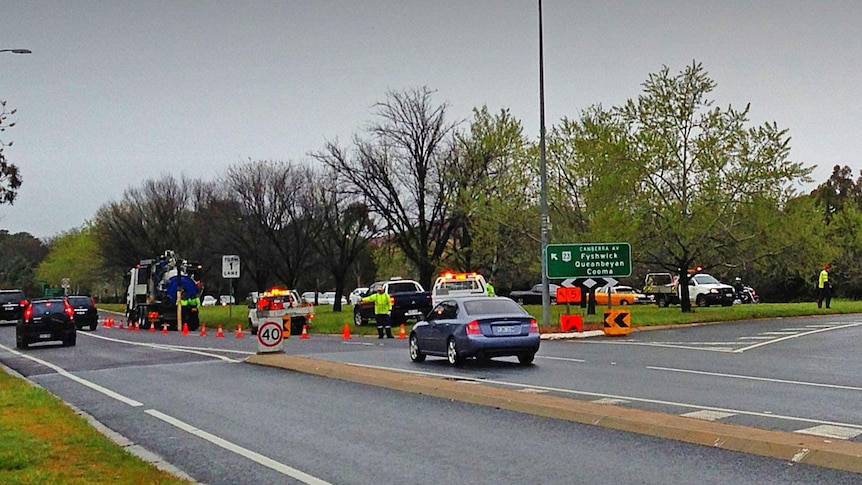 Water being pumped from the road at Canberra Avenue Sturt Avenue roundabout.