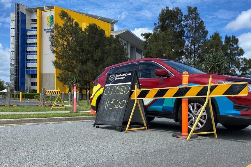 A road closed sign outside a building