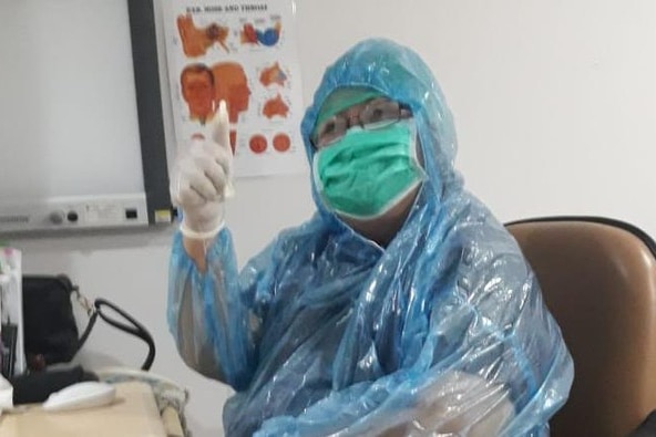 Viral photo of ear, nose and throat specialist Dr Bernadette Albertine Francisca wearing a rain jacket as PPE.