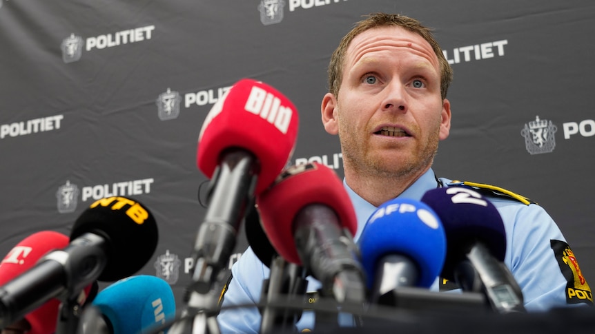 A police officer speaks at a press conference.