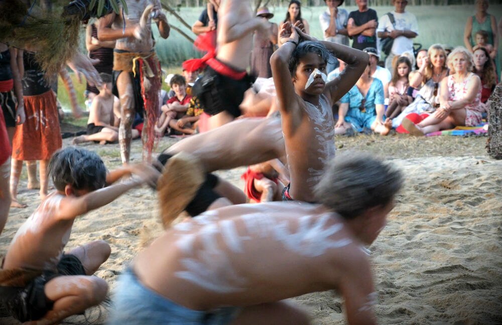 Young Aboriginal dancers performing to a crowd