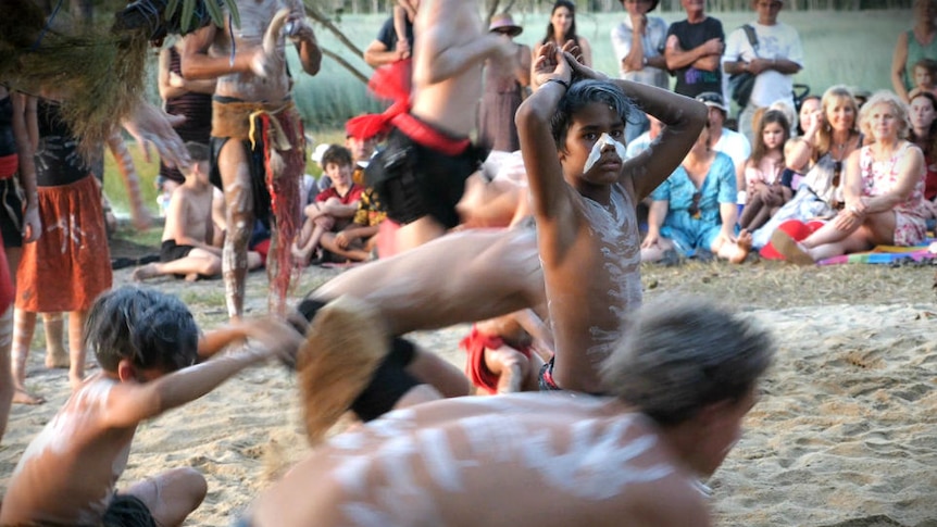 Young Aboriginal dancers performing to a crowd