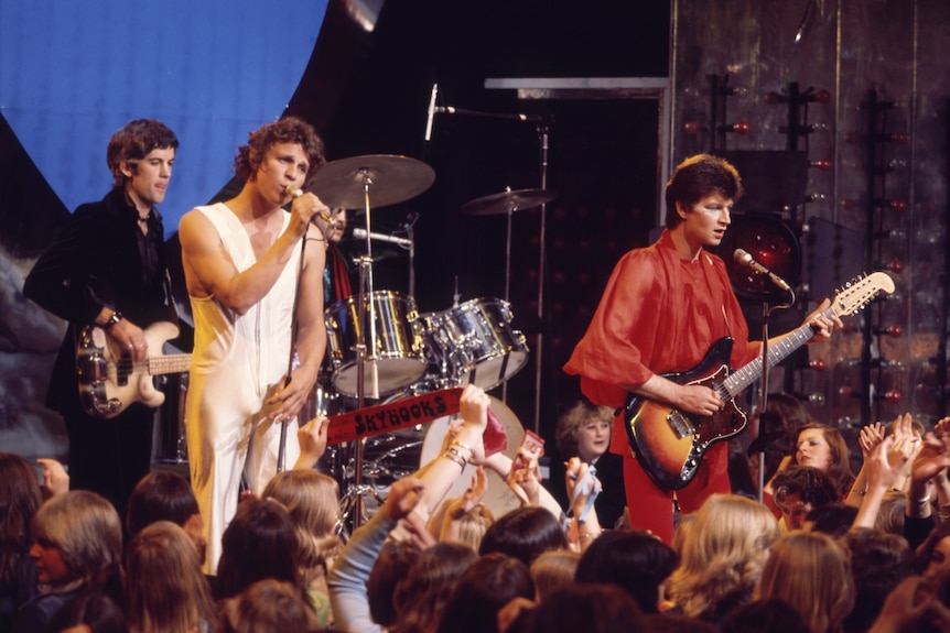 Skyhooks band play on Countdown stage in front of audience 