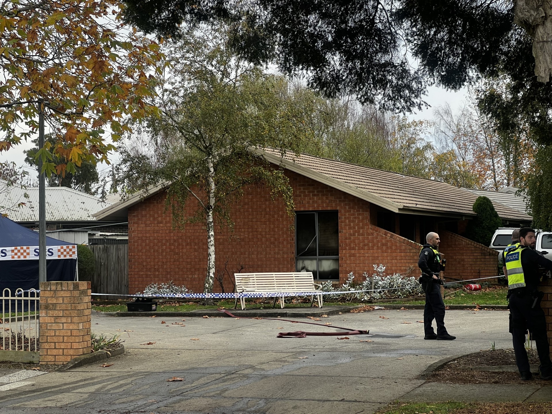 brick unit with police officers and police tape