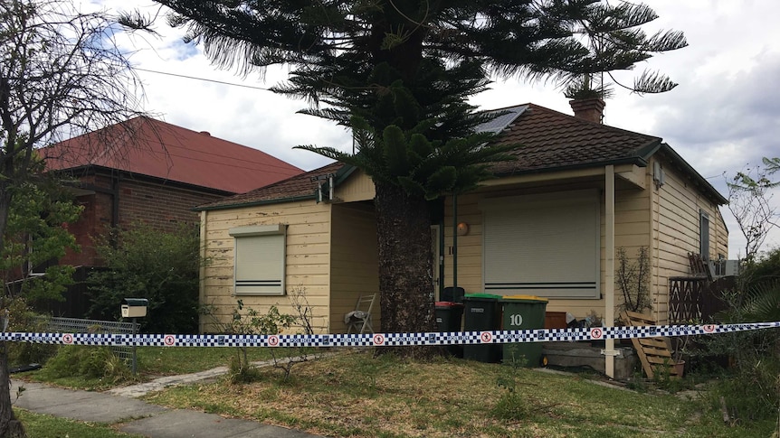 Photo of weatherboard home in Granville with police tape outside that police are searching for remains of missing girl