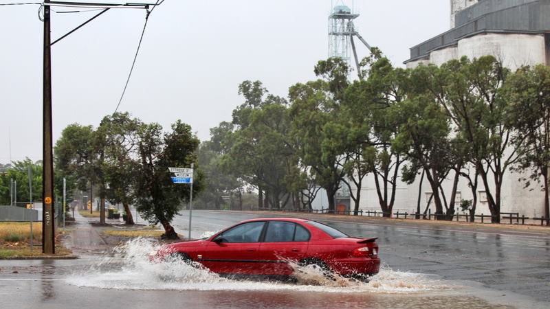 Car negotiates a flooded corner