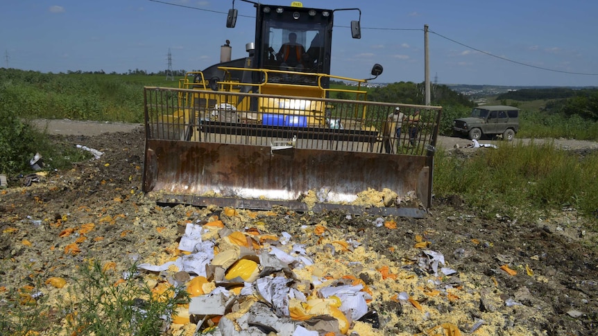 Russian bulldozer destroys illegally imported food