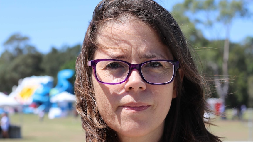 A portrait of a woman looking into the camera.