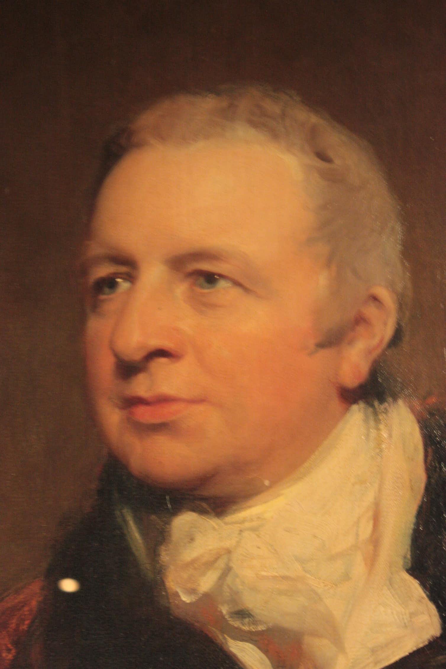 An old painting of a man with blue eyes and short grey hair, wearing a ruffle collared shirt
