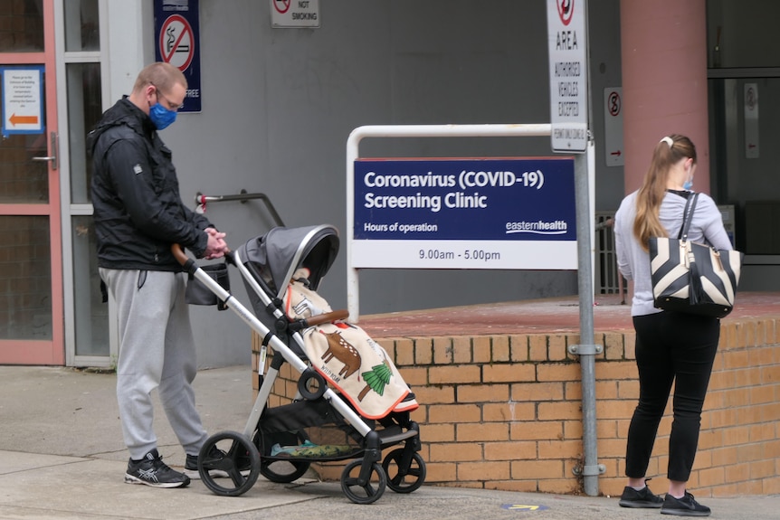 A picture of a COVID-19 testing centre at Box Hill Hospital, with two people queuing to be tested.