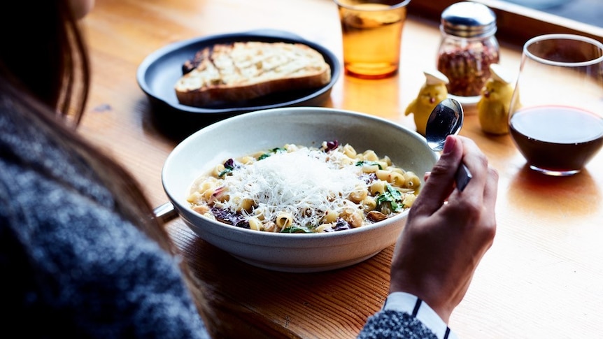 Tubetti with braised fennel, radicchio and chickpeas in bowl at cafe