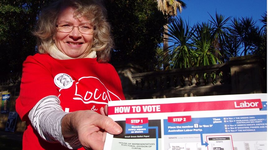 ALP volunteer Cathy Bardon with a how to vote card.