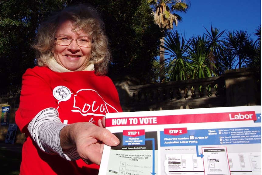 ALP volunteer Cathy Bardon with a how to vote card.