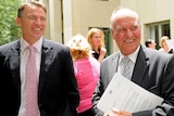 Rob Oakeshott (left) and Tony Windsor leave a press conference.