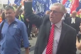 Unionist Bob Carnegie (right) arrives at the Federal Magistrates Court in Brisbane on February 12, 2013