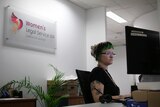 Woman looking at a computer at an office