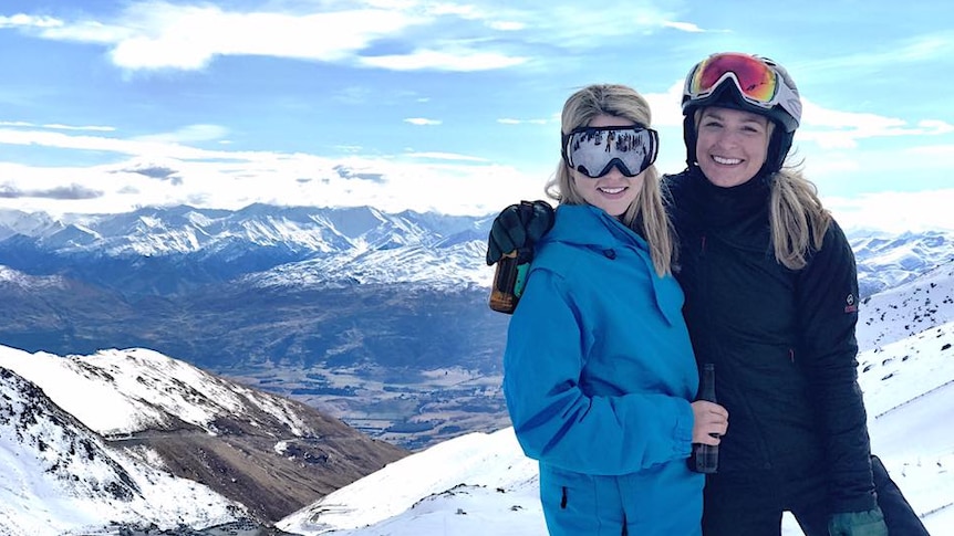 Summer Land with her friend Laura in snow gear on a snowy mountain in a story about the number of friends we need to be happy.