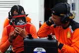 Divers prepare their gear in the search for AirAsia flight QZ8501