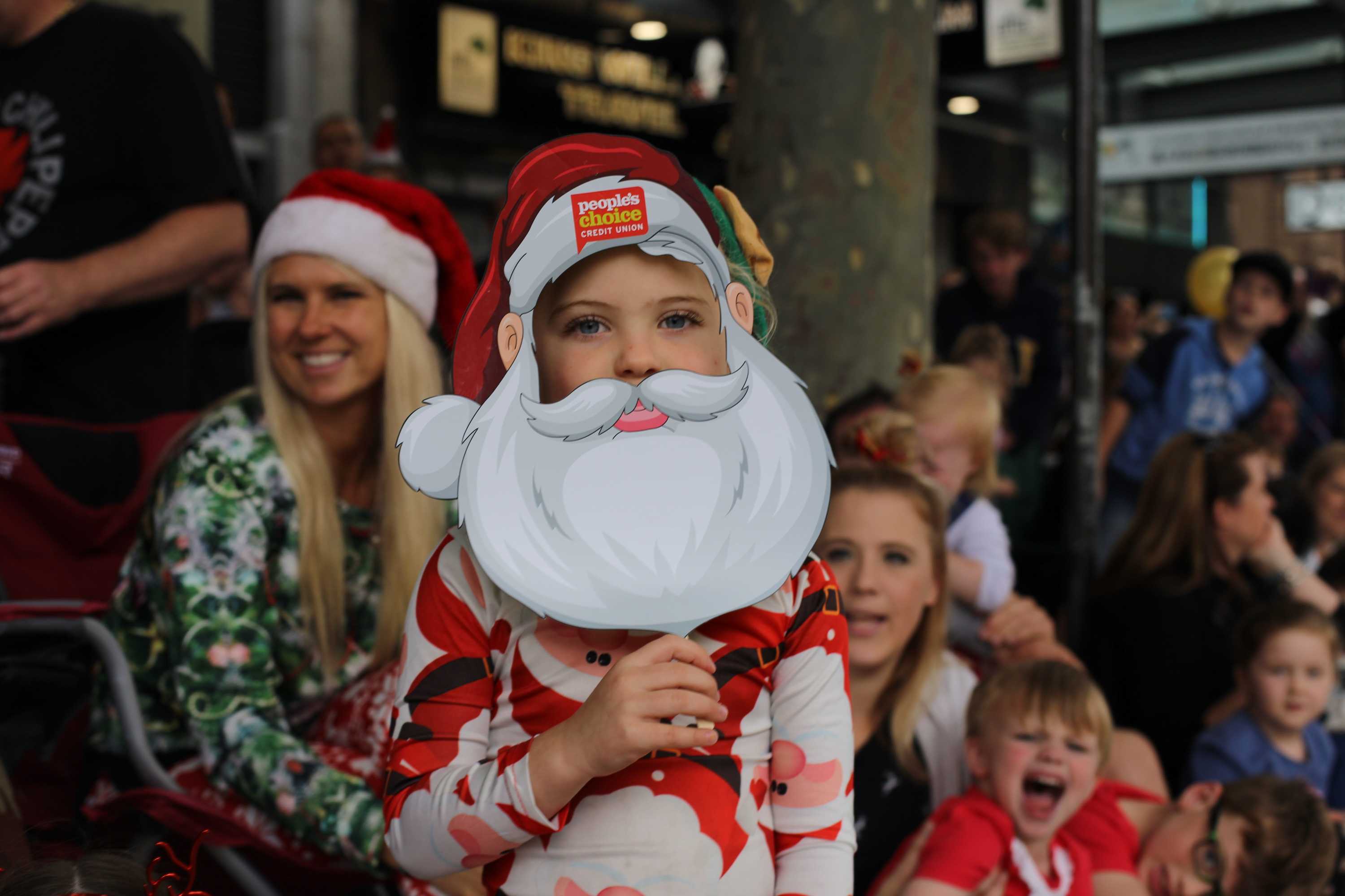 Santa Claus arrives in Adelaide as Christmas pageant winds through town