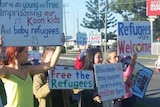 About 40 refugee advocates protesting outside Peter Dutton’s electorate office