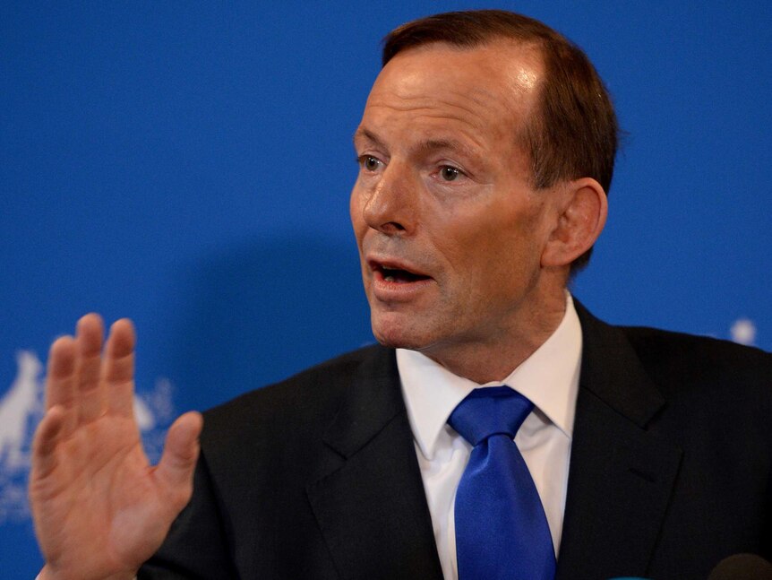 Tony Abbott gestures while addressing media in Sydney