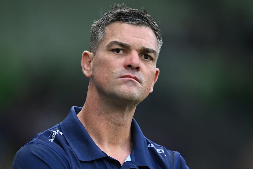 NRL coach Cameron Ciraldo, in a polo shirt, looking on concerned and disappointed, as his team loses