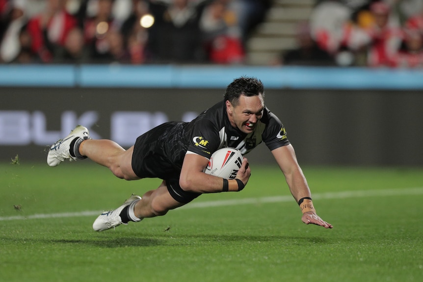 New Zealand Kiwis player Jordan Rapana dives in for a try in a rugby league Test against Tonga.