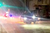 Sparks fly from the punctured wheels of a Ford Ranger as police pursue it through an Adelaide CBD street.