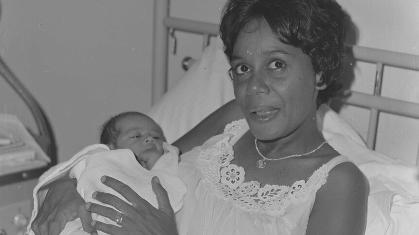BabyJahari Anthony BinDemin in his mother Sally Bin Demin's arms