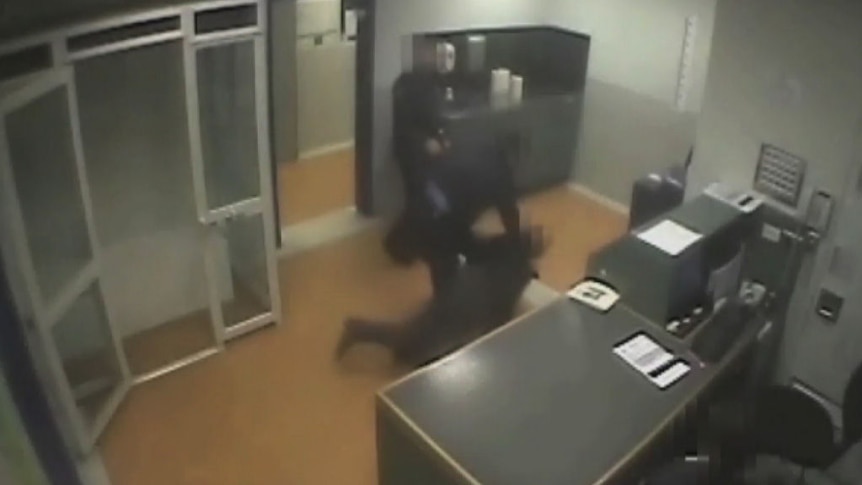 Video shows police officer using 'leg swipe' on man in custody