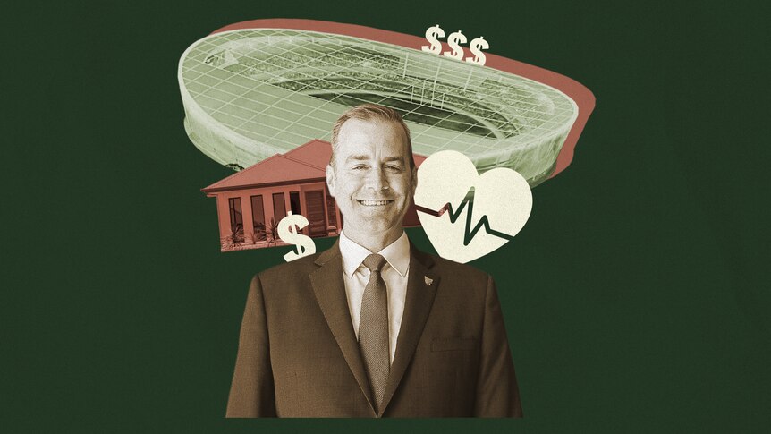 Michael Ferguson stands in front of a graphic representation of a stadium, a house and a heart.