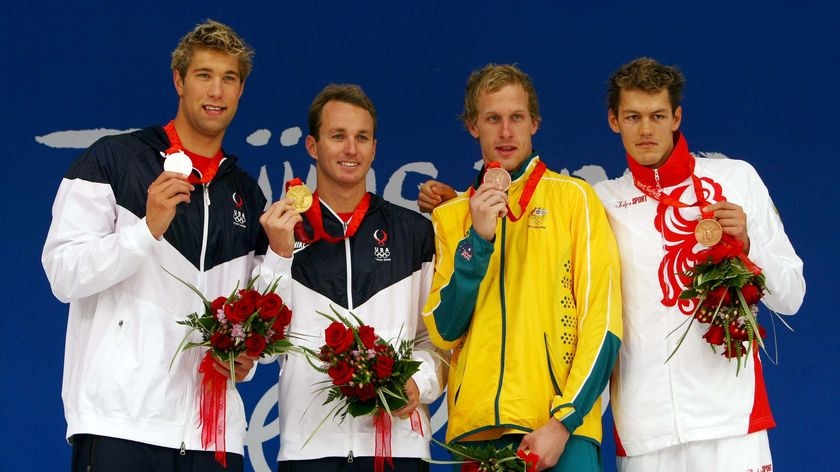 Matt Grevers, Aaron Peirsol, Hayden Stoeckel and Arkady Vyatchanin with their medals