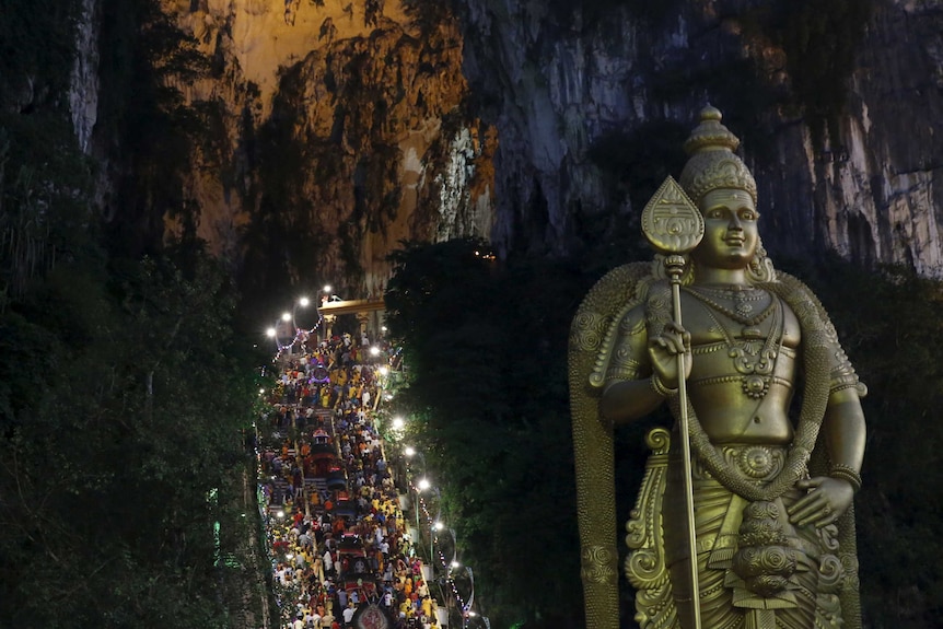 Hindus climbing steps to Batu Caves for Thaipusam