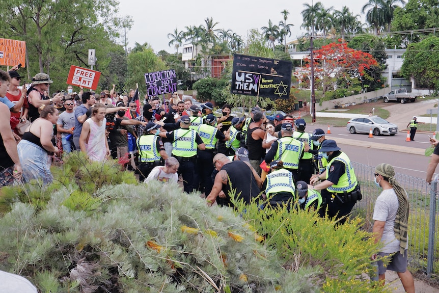 A large crowd clash with police