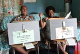 Fijian election officials await voters at a polling station on Taveuni on May 9, 2006.