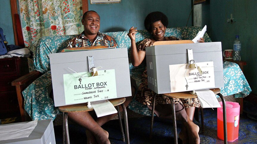 Fijian election officials await voters at a polling station on Taveuni on May 9, 2006.