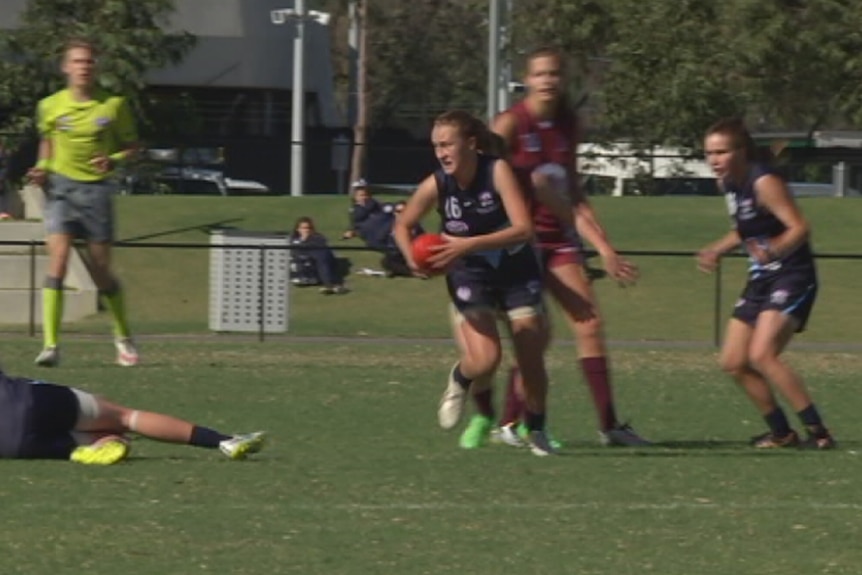 Women play football at the Youth Girls National Championships