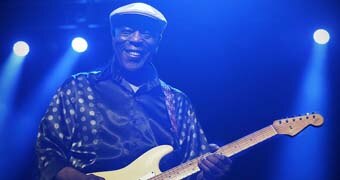 Buddy Guy smiles down camera lens at Bluesfest