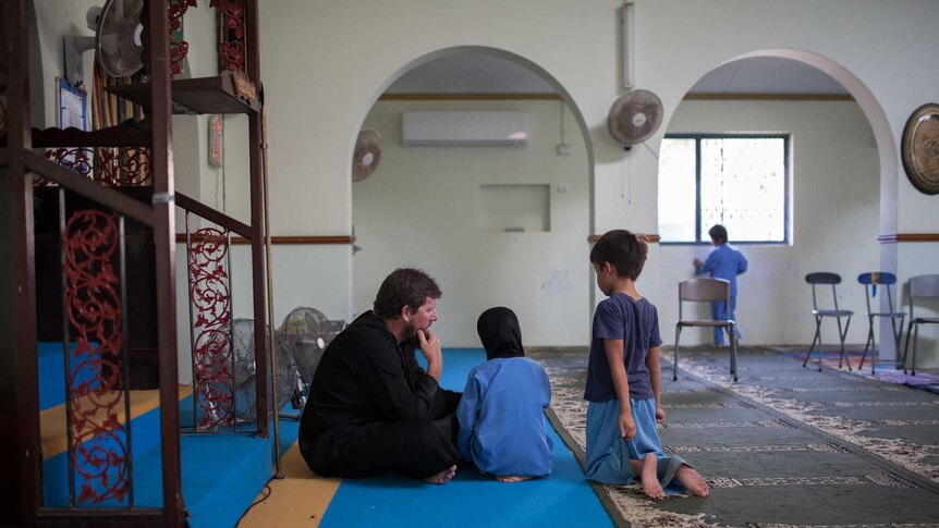 Young children study the Qu'ran in the Christmas Island mosque.