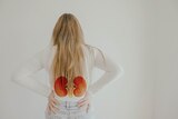 A woman, hands on hips and shown from behind, with kidney illustrations