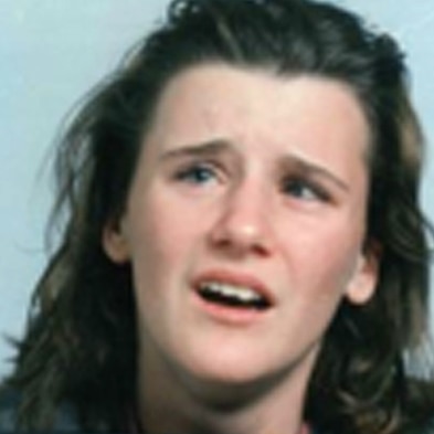 Blurry close-up head shot of a teenage girl.