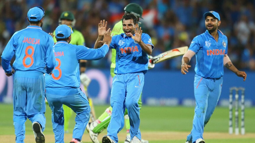 India's Mohammed Shami celebrates with team-mates in the Cricket World Cup match v Pakistan.