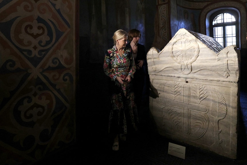Duchess Sophie looks at a piece in Saint Sophia Cathedral